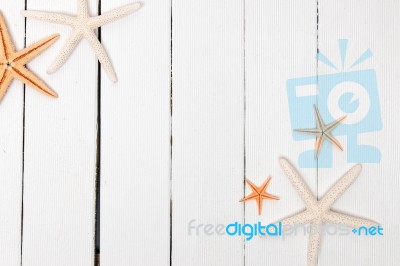 Starfish On White Wood Stock Photo