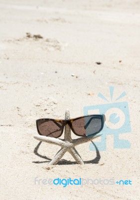 Starfish Standing With Sunglasses Stock Photo