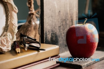 Stationery And Apple On Desk Stock Photo