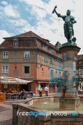 Statue And A Fountain In A Square In Colmar Stock Photo