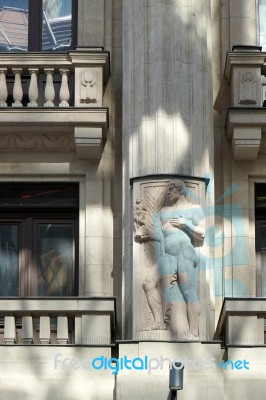 Statue Of A Male Figure On An Apartment Block In Budapest Stock Photo