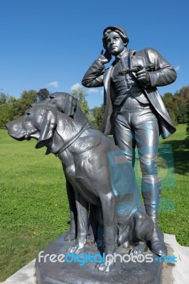 Statue Of A Man And Two Dogs At The Imperial Kaiservilla In Bad Stock Photo