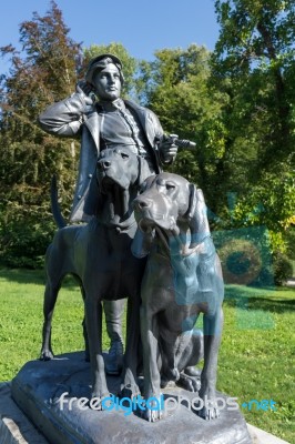 Statue Of A Man And Two Dogs At The Imperial Kaiservilla In Bad Stock Photo