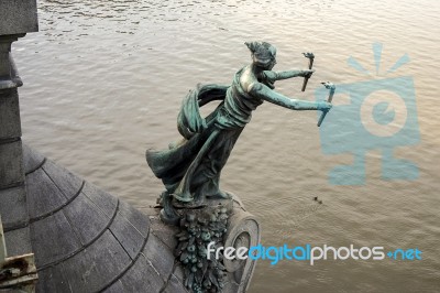 Statue Of A Woman With Torches On The Cechuv Bridge In Prague Stock Photo