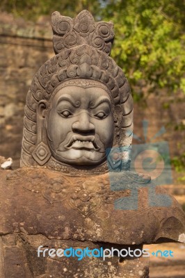 Statue Of Ancient Khmer Warrior Head At Angkor Wat Stock Photo