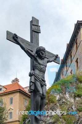 Statue Of Christ On A Wooden Cross In Krumlov Stock Photo