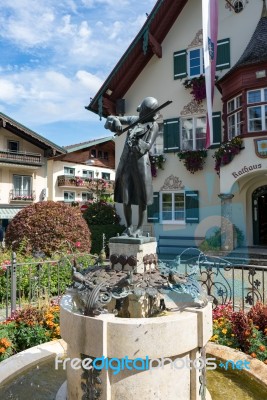 Statue Of Mozart Outside The Town Hall Building In St. Gilgen Stock Photo