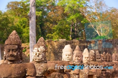 Statues Of Ancient Khmer Warrior Heads Carry Giant Snake Decorat… Stock Photo