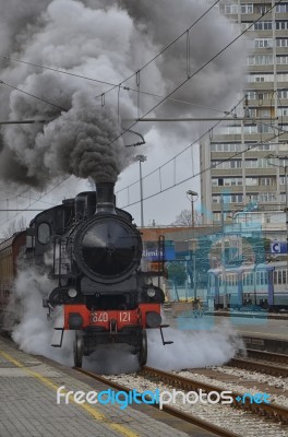 Steam Locomotive Leaving The Station Stock Photo