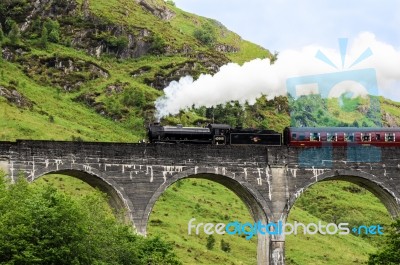 Steam Train On Glenfinnan Viaduct, Known From Harry Potter Stock Photo