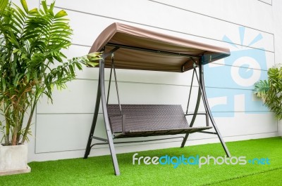 Steel Brown Swing Chair Modern Style On White Concrete Background Stock Photo