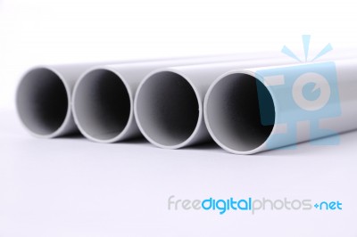 Steel Pipes Cut Front Focus On White Floor Stock Photo