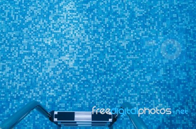 Steel Staircase To Blue Tone Swimming Pool Stock Photo