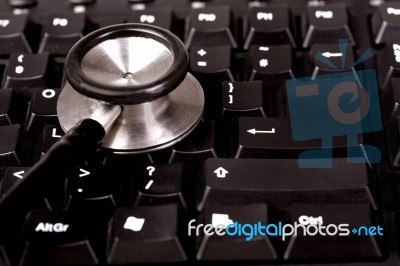 Stethoscope And Computer Keyboard Stock Photo