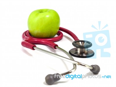 Stethoscope And Fresh Green Apple On White Background. Healthy F… Stock Photo