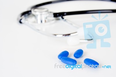 Stethoscope And Pills Stock Photo