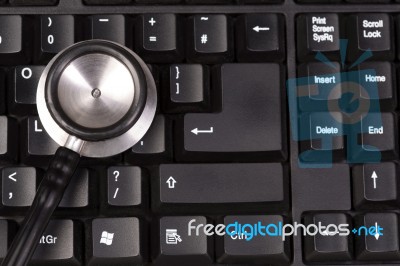 Stethoscope On Keyboard, Closeup Shot Stock Photo