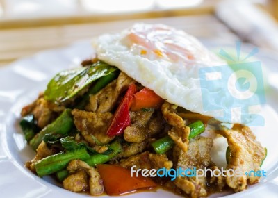 Stir Fried Pork With Curry Paste Serve With Fried Egg Stock Photo