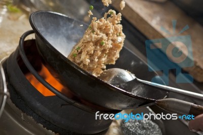 Stir fried rice being cooked in wok Stock Photo