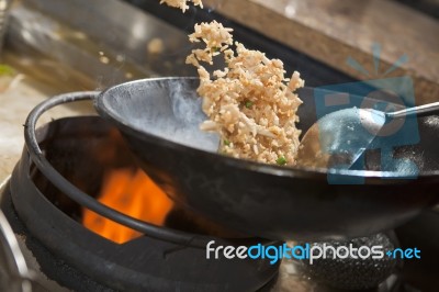 Stir fried rice being cooked in wok Stock Photo