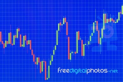 Stock Or Forex Graph Or Candlestick Chart On Blue Screen Stock Photo