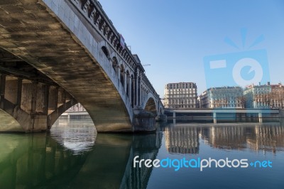 Stone Bridge And City Buildings Stock Photo