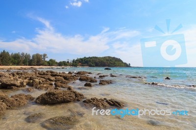 Stone On Beach With Blue Sky Stock Photo