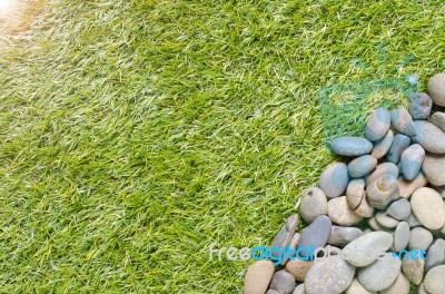 Stone On Grass Background Stock Photo