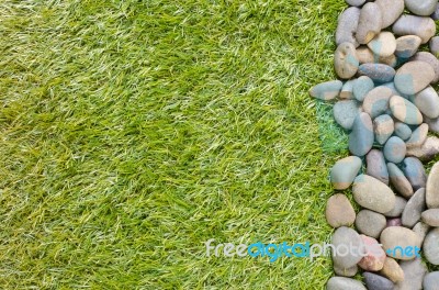 Stone On Grass Background Stock Photo