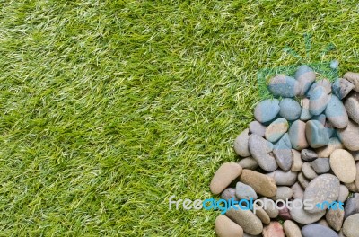 Stone On Grass Background Stock Photo