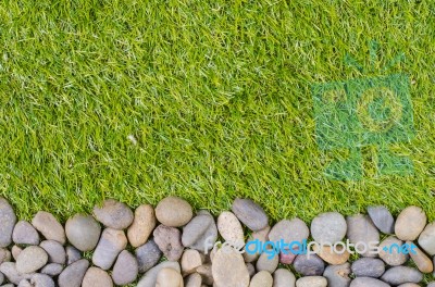 Stone On Grass Background Stock Photo