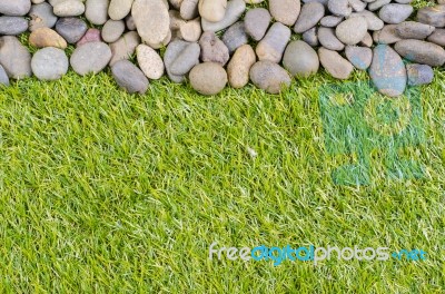 Stone On Grass Background Stock Photo