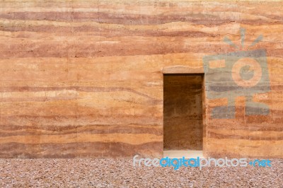 Stone Wall With Door And Stone Floor In Front Off Stock Photo