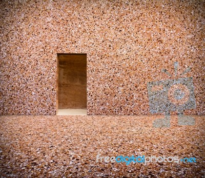 Stone Wall With Door And Stone Floor In Front Off Stock Photo