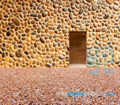 Stone Wall With Door And Stone Floor In Front Off Stock Photo