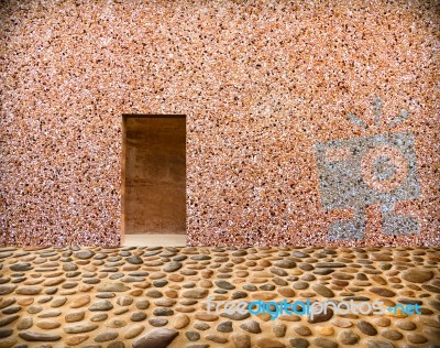 Stone Wall With Door And Stone Floor In Front Off Stock Photo