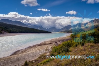 Storm Clouds Gathering Over Lake Sherburne Stock Photo