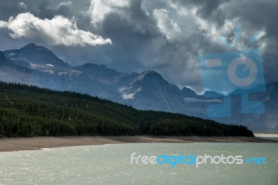 Storm Clouds Gathering Over Lake Sherburne Stock Photo