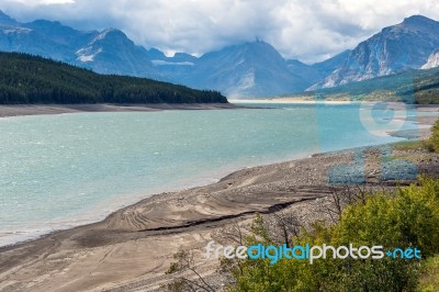 Storm Clouds Gathering Over Lake Sherburne Stock Photo