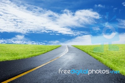 Straight Road With Grassland Stock Photo