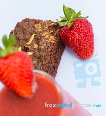 Strawberries And Brownie Indicates Juicy Afters And Fruity Stock Photo