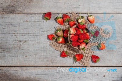 Strawberries On The Old Wooden Stock Photo