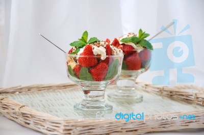 Strawberries With Biscuit Pieces With Mint Whipped Cream Under Stock Photo