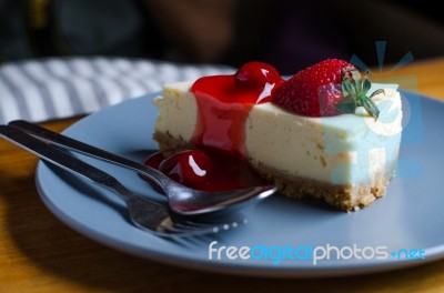 Strawberry Cheesecake With Spoon And Fork Stock Photo