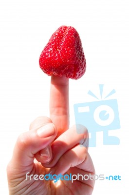 Strawberry On Finger Stock Photo