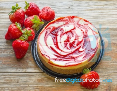 Strawberry Swirled Cheesecake With Fresh Strawberries Stock Photo