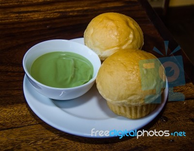 Stream Bread Dipping With Egg Custard Stock Photo