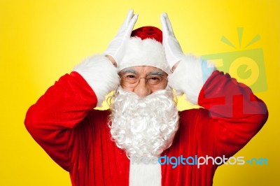 Stressed Out Santa Pressing Against His Temples Stock Photo