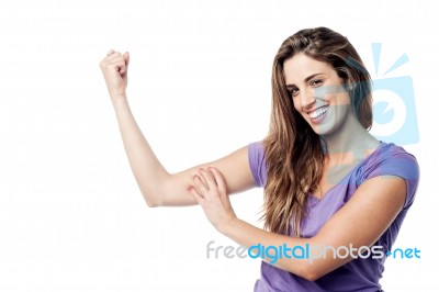 Strong Pretty Girl Showing Her Biceps Stock Photo