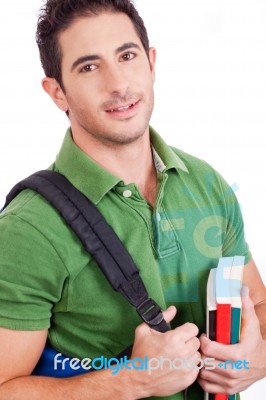 Student Carrying Bag And Books Stock Photo